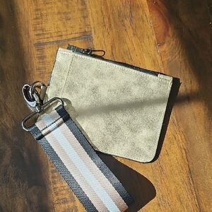 THINK ROYLN Metallic Gold Wristlet with Striped Strap